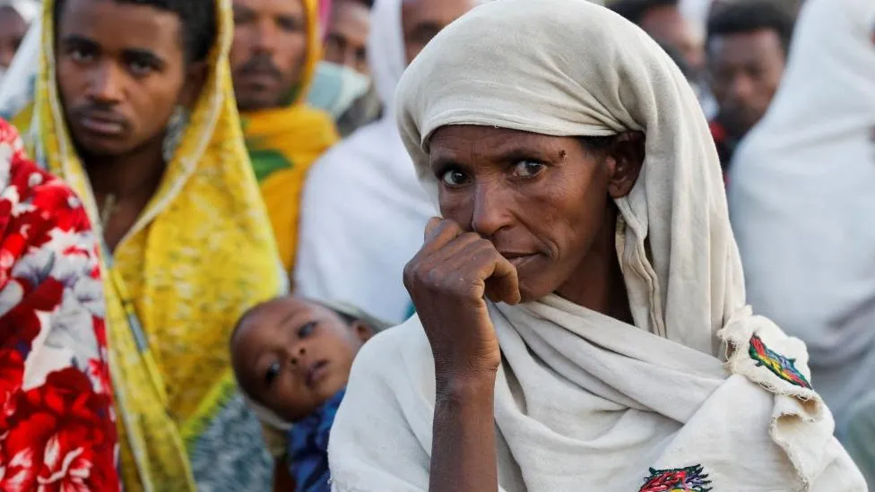 Famine strcken Tigrayans que for food rations in WFP distribution centre in Ethiopia`s Northern Tigray region